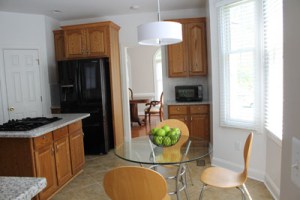 Kitchen updated with new countertops, backsplash and lighting