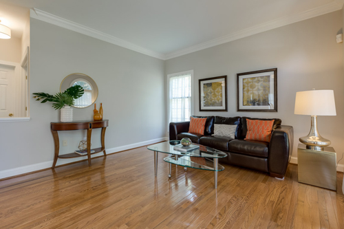 Fresh paint and contemporary furnishings help would-be buyers appreciate the features of this suburban home.